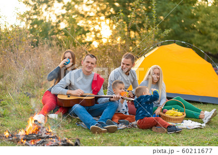 travel, tourism, hike, picnic and people concept - 60211677