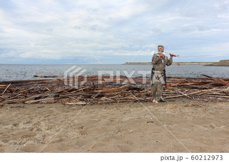 Man controls a kite in summer, Ob reservoir, 60212973