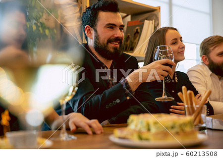 Happy co-workers celebrating while company party and corporate event Happy co-workers celebrating while company party and corporate event 60213508