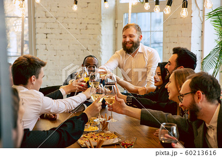 Happy co-workers celebrating while company party and corporate event Happy co-workers celebrating while company party and corporate event 60213616