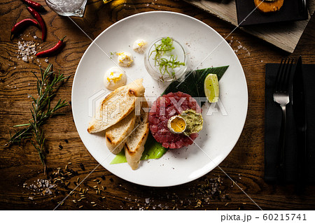 Tuna tartare served on a plate in restaurant 60215741