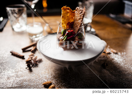 Chocolate mousse served with liquid ice smoke Chocolate mousse served with liquid ice smoke 60215743