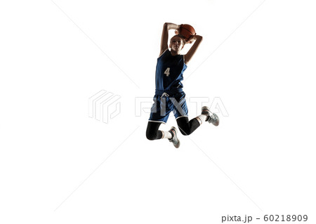 Young caucasian female basketball player against white studio background Young caucasian female basketball player against white studio background 60218909