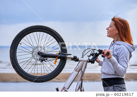 Red-haired middle-aged woman in sportswear Red-haired middle-aged woman in sportswear 60219617