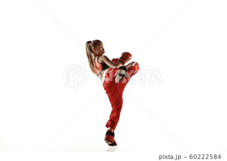 Young female kickboxing fighter training isolated on white background Young female kickboxing fighter training isolated on white background 60222584