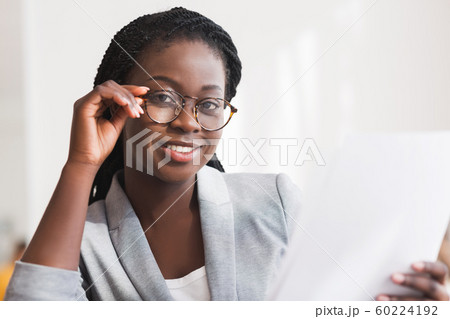 Closeup Portrait Of Young Black Secretary With Papers In Hand 60224192