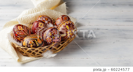 Easter eggs decorated with wax resist technique 60224577