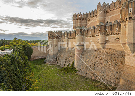 Moat and partial view of the walls of the castle 60227748