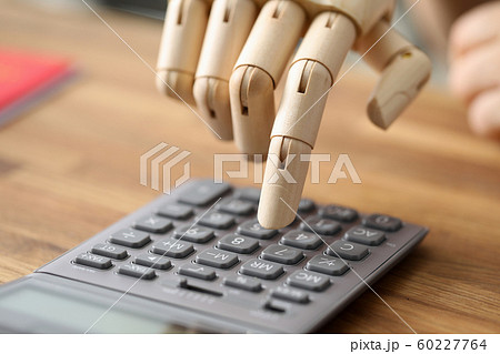 Calculator on wooden desk Calculator on wooden desk 60227764