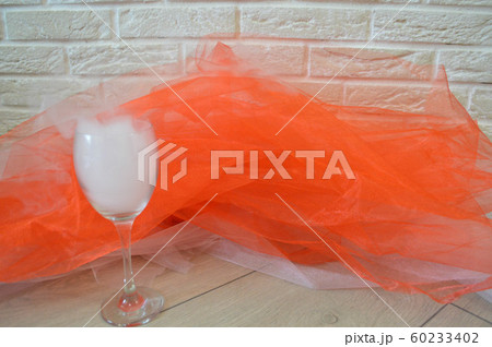 A wine glass with smoke on the background of A wine glass with smoke on the background of 60233402