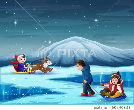 Happy children playing in winter season Happy children playing in winter season 60240333
