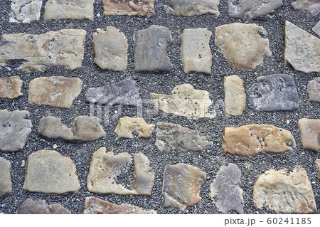 Paving stones road with gravel 60241185