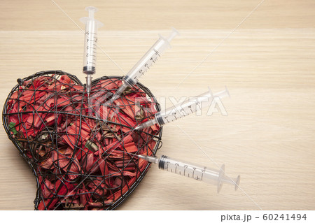 heart syringe wooden table background heart syringe wooden table background 60241494