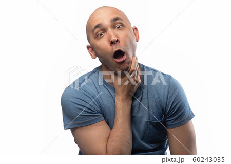 Photo of grimacing shaved man on white background 60243035