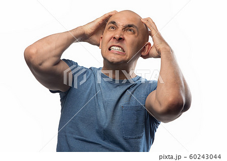 Bald man touching his head on white background Bald man touching his head on white background 60243044