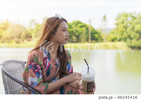Asian beautiful woman enjoying drink coffee cold 60245416