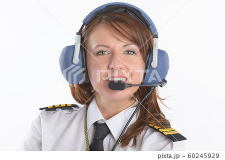 Woman airline pilot with headset 60245929