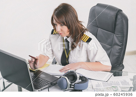 Woman airline pilot at the office Woman airline pilot at the office 60245936