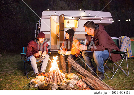 Group of close friends camping together in the mountains Group of close friends camping together in the mountains 60246335