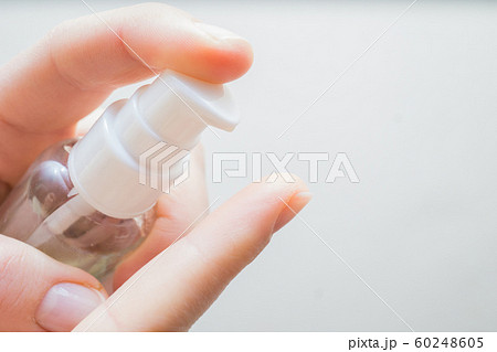 woman hands applying moisturizing cream to her finger skin from a tube. beautiful girl dropping collagen moisturizer serum into her hand at home woman hands applying moisturizing cream to her finger skin from a tube. beautiful girl dropping collagen moisturizer serum into her hand at home 60248605