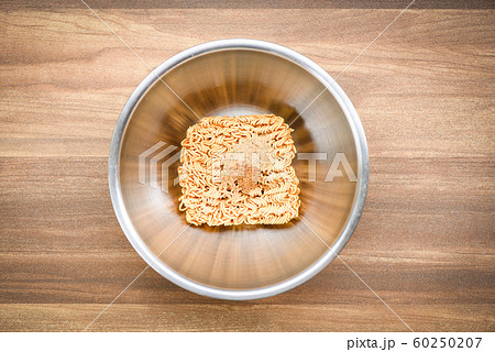 instant noodles on bowl with seasonings monosodium 60250207