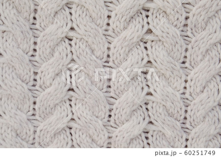 Beautiful beige knitted texture for background. White winter backdrop. Beautiful beige knitted texture for background. White winter backdrop. 60251749