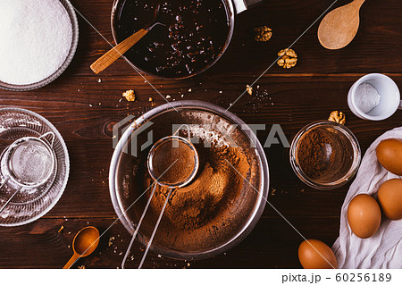 Top view sifted cocoa powder and flour in bowl 60256189