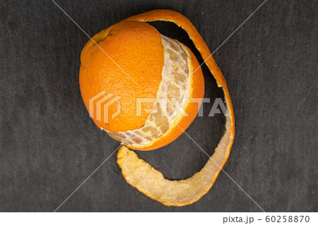 Fresh orange mandarin on grey stone Fresh orange mandarin on grey stone 60258870