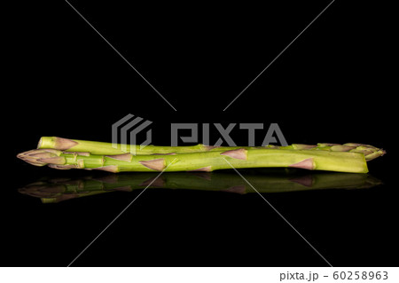 Healthy green asparagus isolated on black glass 60258963