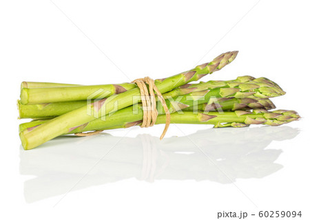 Healthy green asparagus isolated on white Healthy green asparagus isolated on white 60259094