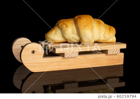 Sweet mini croissant isolated on black glass Sweet mini croissant isolated on black glass 60259794