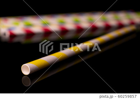 Colorful paper straw isolated on black glass 60259857