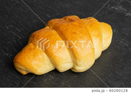 Sweet mini croissant on grey stone Sweet mini croissant on grey stone 60260128