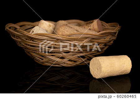 Common wine cork isolated on black glass Common wine cork isolated on black glass 60260465
