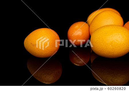 Tasty orange kumquat isolated on black glass 60260820