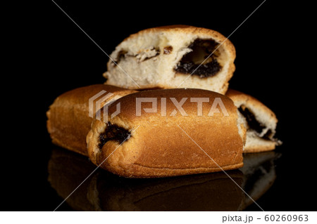 Czech sweet bun isolated on black glass Czech sweet bun isolated on black glass 60260963