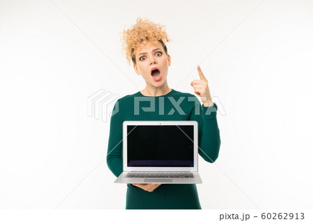 curly blonde girl holding a laptop with mockup with the screen forward on a white background curly blonde girl holding a laptop with mockup with the screen forward on a white background 60262913