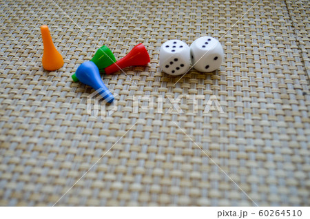 White dice and four figures for table games. 60264510