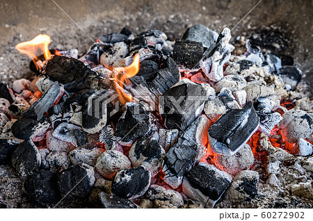 BBQ Grill Pit Glowing And Flaming Hot Charcoal Briquettes coal Food Background Or Texture Close-Up Top View 60272902