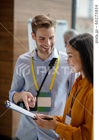 Two colleagues feeling happy with the results of their work Two colleagues feeling happy with the results of their work 60273834