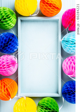 Festive background with colorful paper balls. Festive background with colorful paper balls. 60284221