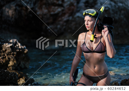 Aqua woman diver spearfishing gun. Aqua woman diver spearfishing gun. 60284652