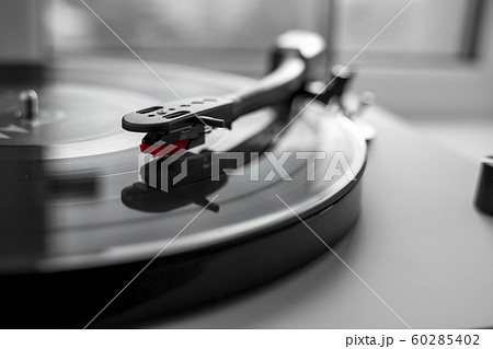 Vinyl turntable on a white background. Retro audio equipment for vinyl disk. Vinyl turntable on a white background. Retro audio equipment for vinyl disk. 60285402