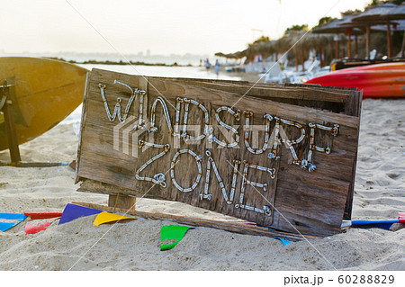 Windsurf zone wooden beach sign. Summer sea shore background. 60288829