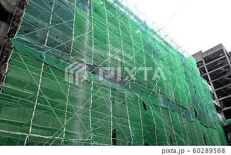 Plastic or nylon netting erected at the external of the under-construction building to prevent construction debris from falling down. Temporary installed. 60289568
