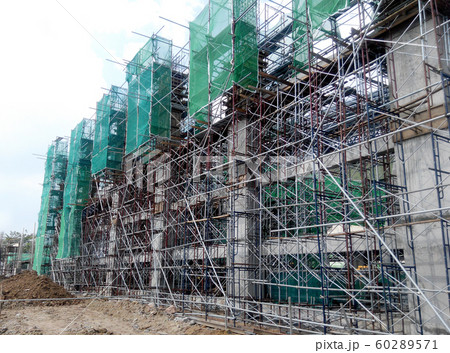 Plastic or nylon netting erected at the external of the under-construction building to prevent construction debris from falling down. Temporary installed. 60289571