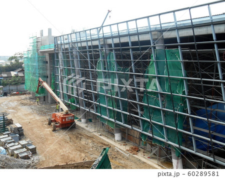 Plastic or nylon netting erected at the external of the under-construction building to prevent construction debris from falling down. Temporary installed. 60289581