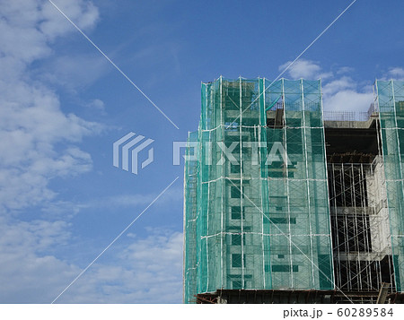 Plastic or nylon netting erected at the external of the under-construction building to prevent construction debris from falling down. Temporary installed. 60289584