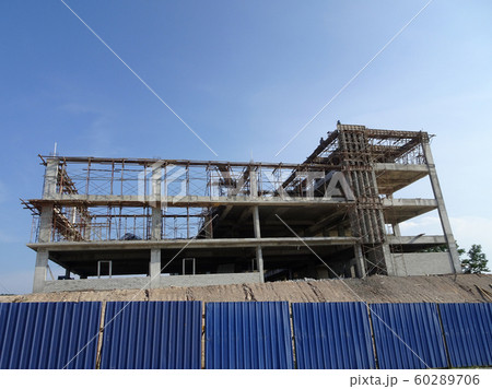 Building reinforcement concrete structure at the construction site. Post, beam and slab constructed using timber formwork by construction workers.  60289706