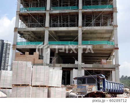 Building reinforcement concrete structure at the construction site. Post, beam and slab constructed using timber formwork by construction workers.  60289712